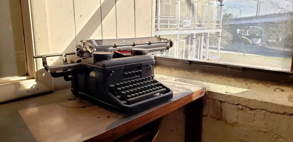 Reminiscent of the 1920s when the Florida Casket Company erected its three-story casket factory, this old typewriter sits sentinel on the second floor, awaiting demolition in preparation for renovation.